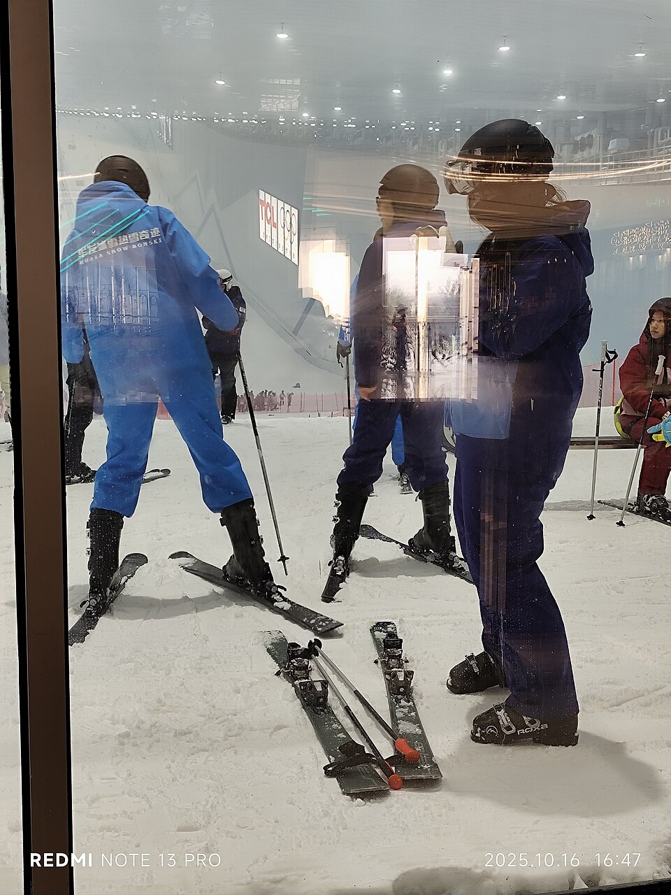 Ski area at Qianhai Snow World, viewed through a window